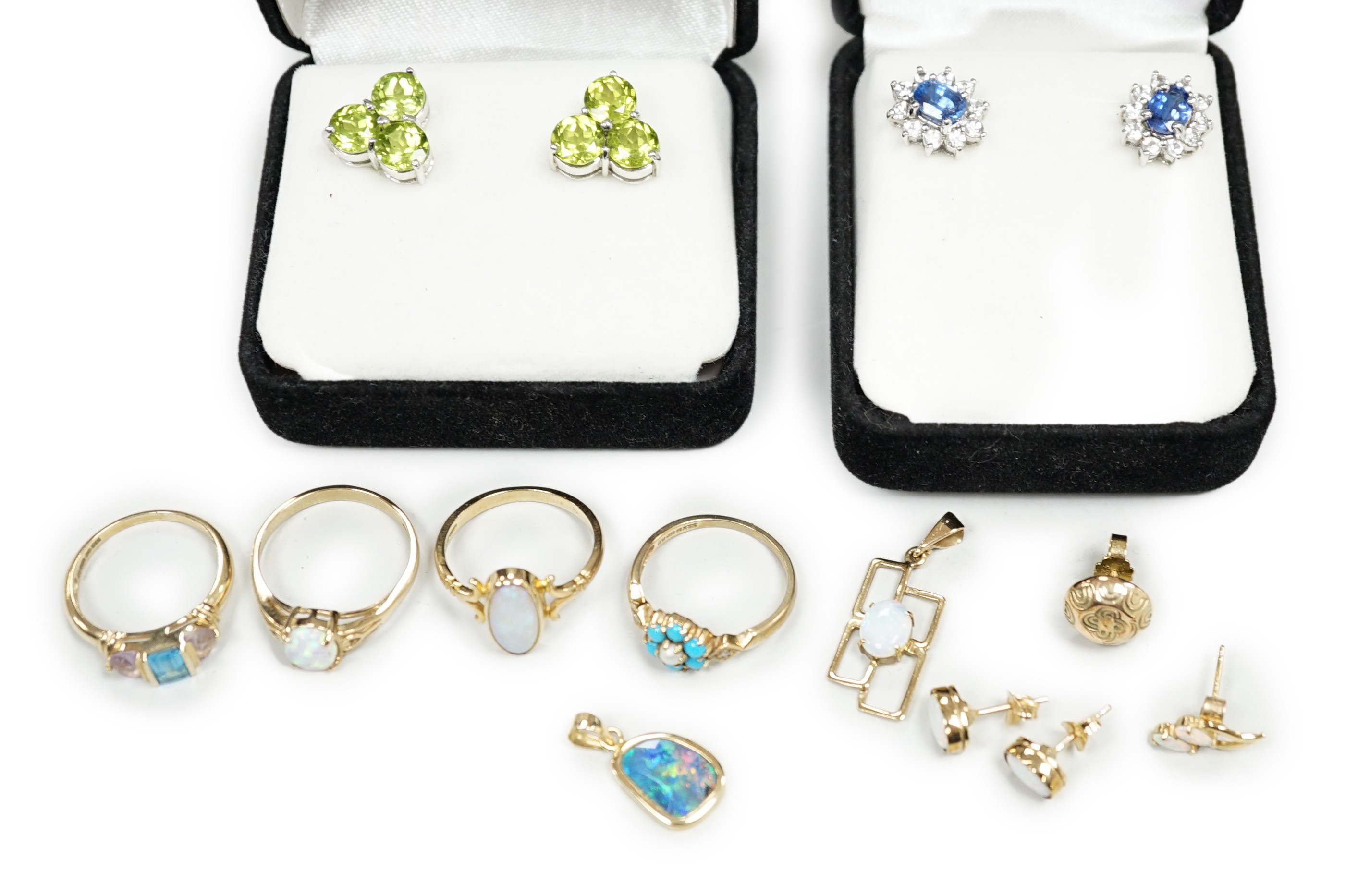 Four assorted modern 9ct gold and gem set rings including two white opal, gross weight 9.4 grams, two pairs of modern 9ct gold and gem set ear studs and other minor jewellery.